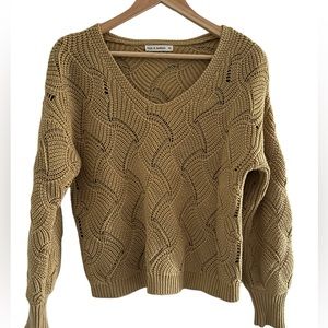 Mustard open knit neck sweater.